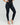 High waist, dark blue, skinny jeans worn by a model in heels