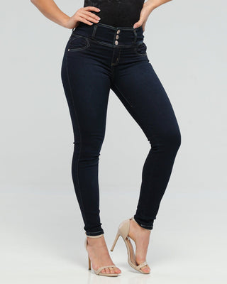 High waist, dark blue, skinny jeans worn by a model in heels